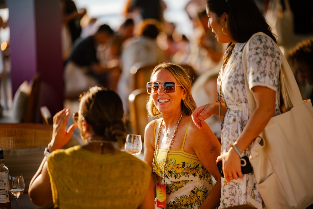 Crowd gathering for a sunset session by the pool